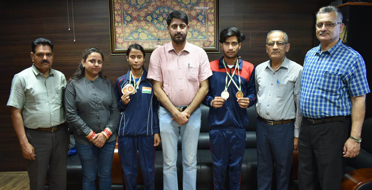 Top ranked sport climbers of India Shivani Charak and Ajay Deep Singh posing for a photograph with Dr Naseem Javaid Choudhary, Secretary J&K State Sports Council and other dignitaries. Top ranked sport climbers of India Shivani Charak and Ajay Deep Singh posing for a photograph with Dr Naseem Javaid Choudhary, Secretary J&K State Sports Council and other dignitaries.