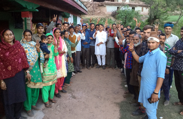 R S Pathania flanked by locals during public meeting in Ramnagar village on Tuesday. R S Pathania flanked by locals during public meeting in Ramnagar village on Tuesday.