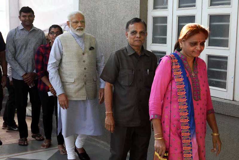 PM Modi caste his vote in queue in Ahmedabad on Tuesday. PM Modi caste his vote in queue in Ahmedabad on Tuesday.