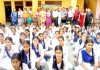 Students posing along with JMC members, school management and staff during awareness programme at GGHSS Nowabad in Jammu.