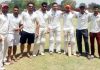 Players of National Cricket Club posing for a group photograph after registering victory in Jammu on Friday.