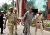 Poonch villager being handed over to Indian authorities at Chakkan-Da-Bagh LoC point on Friday. -Excelsior/ Gurmeet Singh