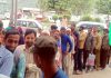 DC Rajouri Mohd Aijaz Asad (in circle) standing in queue to get registration slip as comman man during surprise visit at District Hospital. -Excelsior/Bhat