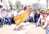 Locals and Congress workers protesting against Traffic Police at Udhampur on Friday.