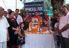 Medical employees paying tributes to martyrs Hoshiar Singh and Shashi Bala at Samba on Saturday.