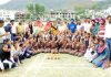 Winners of different disciplines of girls teams posing with officials at Sports Stadium Poonch on Tuesday.