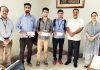 YCET students posing with scholarship cheques received from Yogoda Satsang Dhyan Kendra.