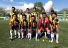 Footballers posing for a group photograph after winning the title in Srinagar.