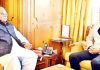 Governor S P Malik and former civil servant Shah Faesal during meeting on Tuesday.