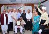 Nami Dogri Sanstha conferring ‘Ustad Allah Rakha Ji Award’ to veteran Tabla player Rajinder Kumar Raina at Jammu on Saturday.