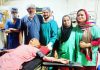 Doctors posing with a 90-year-old patient on which they performed laparoscopic cholecystectomy at Maxxlyfe Hospital, Jammu.