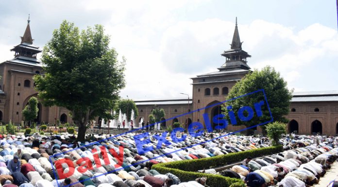 People offer Eid prayers at Jamia Masjid in Srinagar on Wednesday. —Excelsior/Shakeel