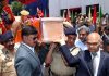 Advisors carrying mortal remains of martyr at DPL Srinagar on Monday.