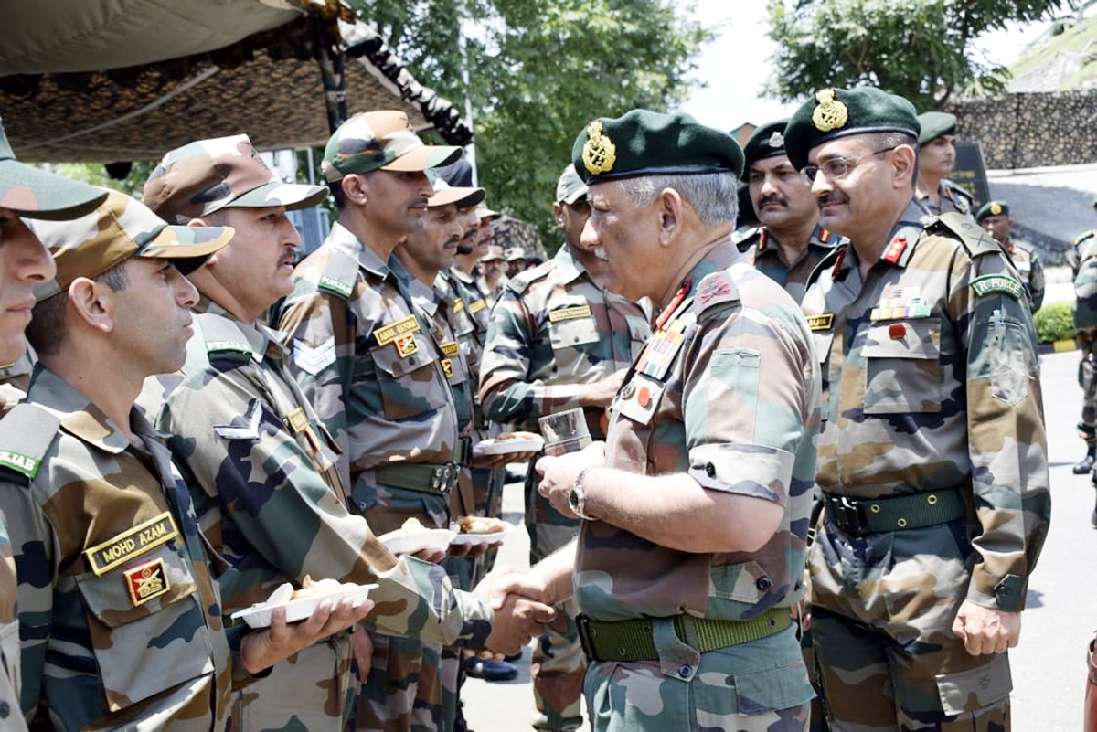 Army chief Gen Bipin Rawat interacting with troops near LoC in Rajouri sector on Friday.