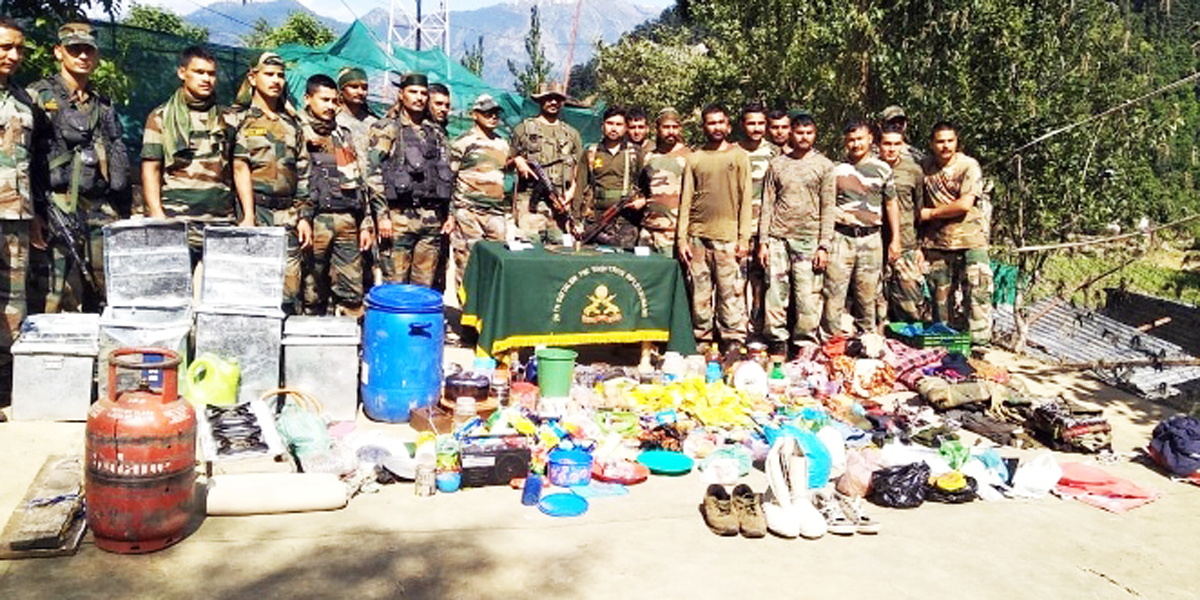 Army and SOG personnel displaying materials recovered at Keshwan, Kishtwar on Sunday. —Excelsior/Tilak Raj Army and SOG personnel displaying materials recovered at Keshwan, Kishtwar on Sunday. —Excelsior/Tilak Raj