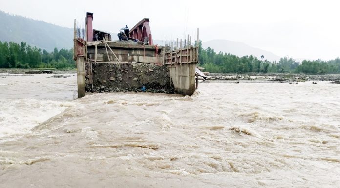 Achthal village in South Kashmir’s Kulgam district was disconnected due to flash floods in Nalla Veshow on Wednesday. —Excelsior/Sajjad Dar