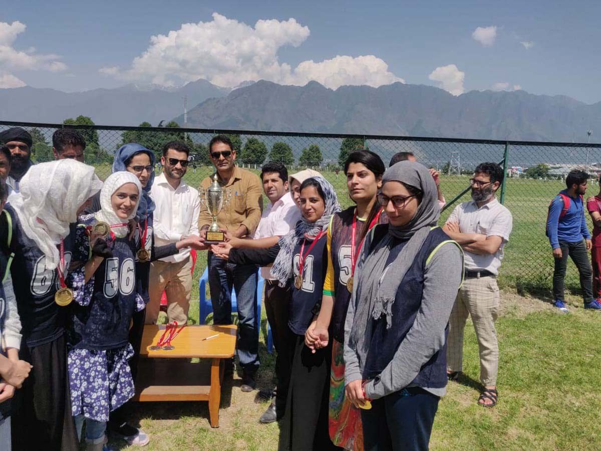 Winners of Inter Department Volleyball Tournament receiving trophy in Srinagar on Saturday.