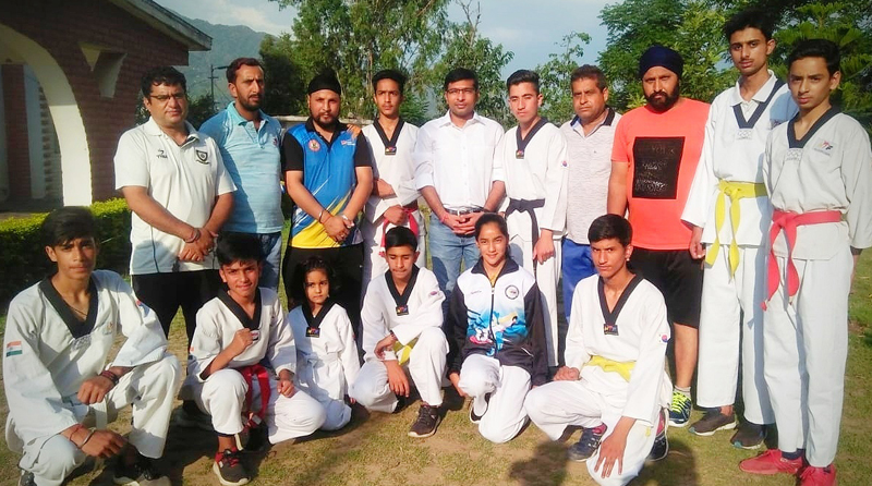 Taekwondo players from Poonch posing for a group photograph during flag off ceremony. Taekwondo players from Poonch posing for a group photograph during flag off ceremony.