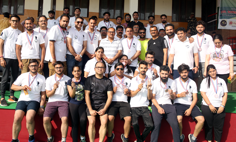 Winners and other participants of 5 Kms Run posing for a group photograph along with dignitaries in Jammu.