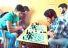 Players showing keen interest during a Chess game in Srinagar.