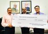 Chartered Accountants handing over a cheque of Rs.75 lakh to Union Minister Dr Jitendra Singh, as a contribution to the Prime Minister's National Relief Fund, at New Delhi, on Friday.