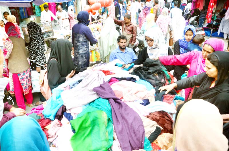 Huge rush of shoppers in Srinagar on the eve of Eid festival. -Excelsior/Shakeel Huge rush of shoppers in Srinagar on the eve of Eid festival. -Excelsior/Shakeel