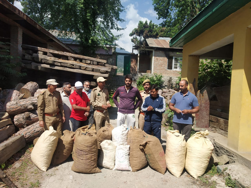 Team of Forest Department along with the seized consignment of rare herb at Bhadarwah. — Excelsior/Tilak Raj