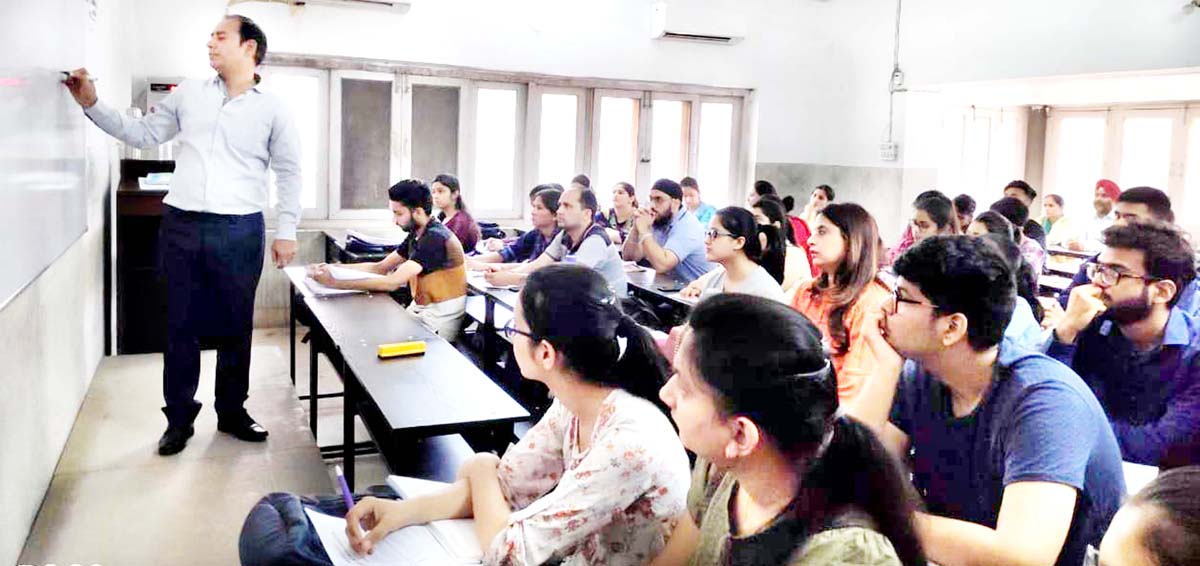 An expert guiding the KAS aspirants on writing skills at SRCC in Jammu. An expert guiding the KAS aspirants on writing skills at SRCC in Jammu.