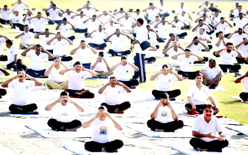 BSF personnel practicing Yoga at BSF Headquarters, Paloura in Jammu. -Excelsior/Rakesh