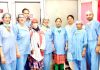 A team of doctors and technicians of Government Hospital Gandhi Nagar posing after performing a complex surgery in the hospital.