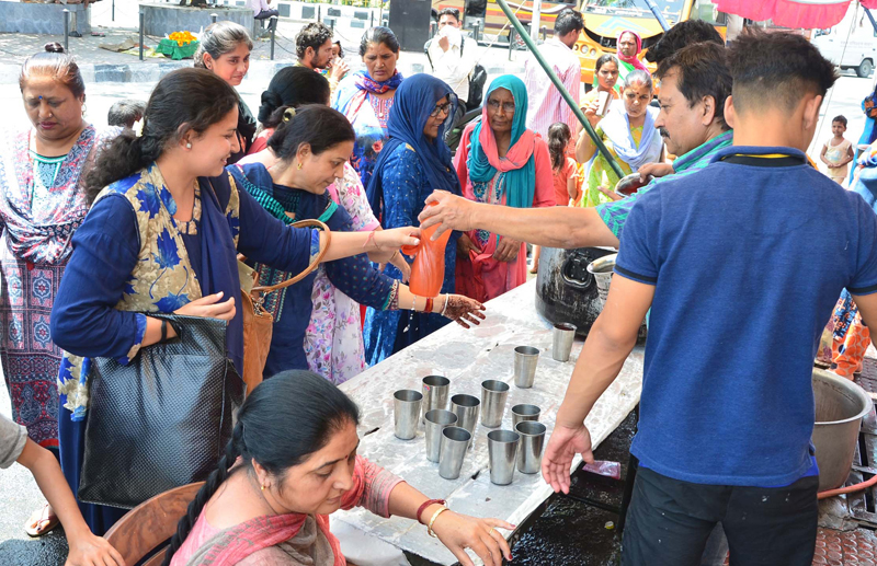 Volunteers serving cold sweet water to people on the occasion of Nirjala Ekadashi in Jammu on Thursday. Volunteers serving cold sweet water to people on the occasion of Nirjala Ekadashi in Jammu on Thursday.