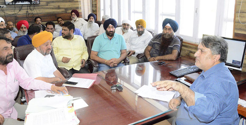 timpusk (5) Principal Secretary Transport Dr Asgar Samoon at a meeting with transporters at Srinagar on Thursday.