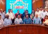 Union Minister Dr Jitendra Singh posing for group photograph with officials of DoPT and NIC after officially launching first-ever "e-Profile List" of IAS Officers, at North Block, New Delhi on Monday.