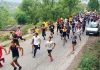 Youths running during a marathon organized against drug abuse in Udhampur district.