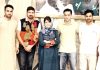 Former Chief Minister, Mehbooba Mufti posing for a photograph with youth activists of party at Srinagar on Tuesday.