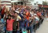 Shri Amarnath bound yatries in long queues waiting to enter Bhagwati Nagar Yatri Niwas on Friday. -Excelsior/Rakesh