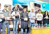 Dignitaries releasing novel at Srinagar on Sunday.