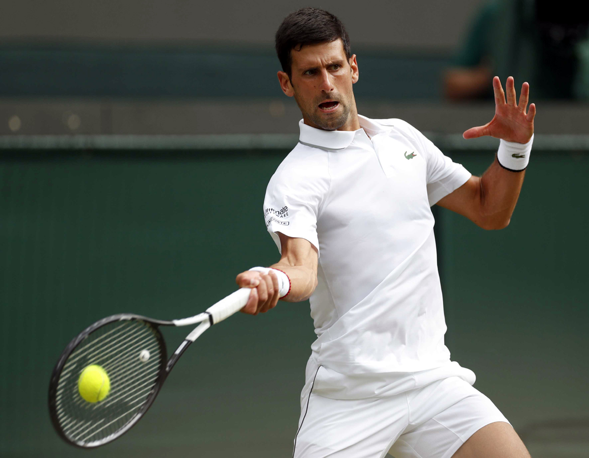 Novak Djokovic returns the ball during the men's singles fourth round match against Ugo Humbert of France during the 2019 Wimbledon Tennis Championships in London. (UNI)