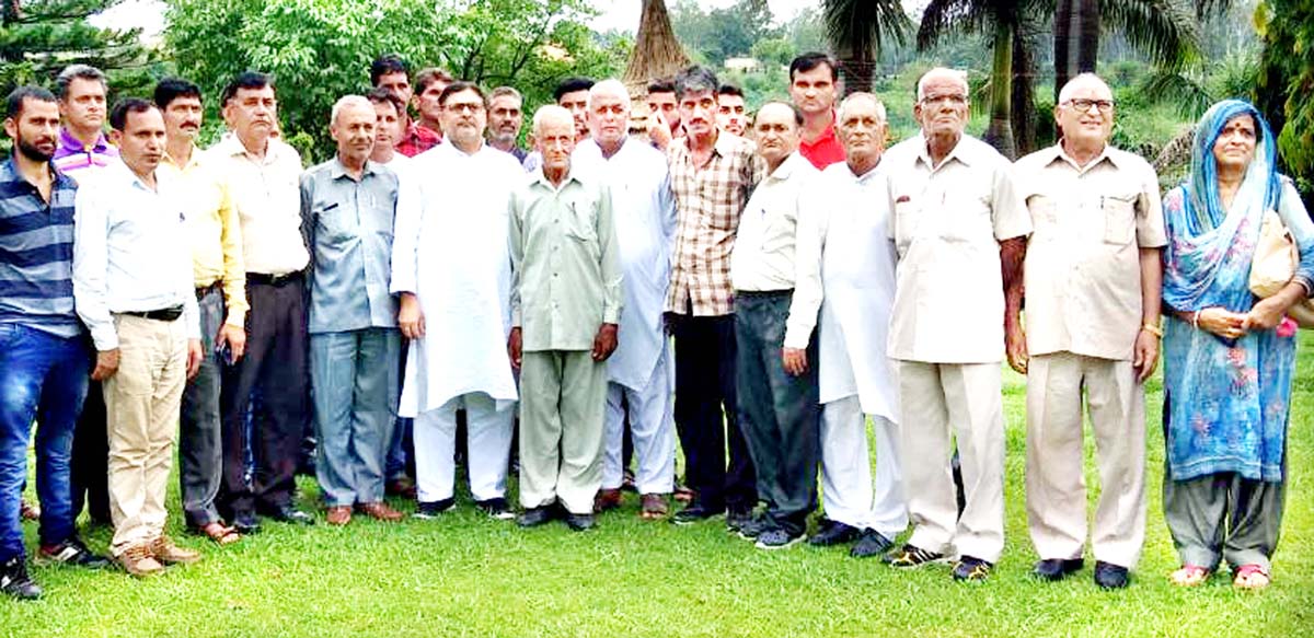 Former MP Madan Lal Sharma and BCC Chowki Chora members during meeting at Akhnoor.