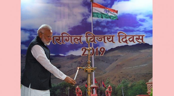 Prime Minister Narendra Modi lighting the lamp at a programme to mark Kargil Vijay Diwas in New Delhi on Saturday. (UNI)