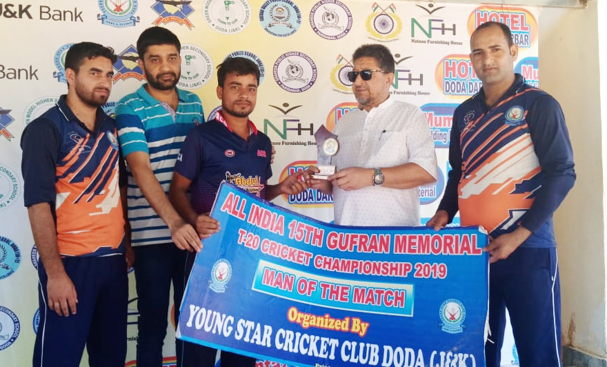 Winner receiving man of the match award at Sports Stadium in Doda.