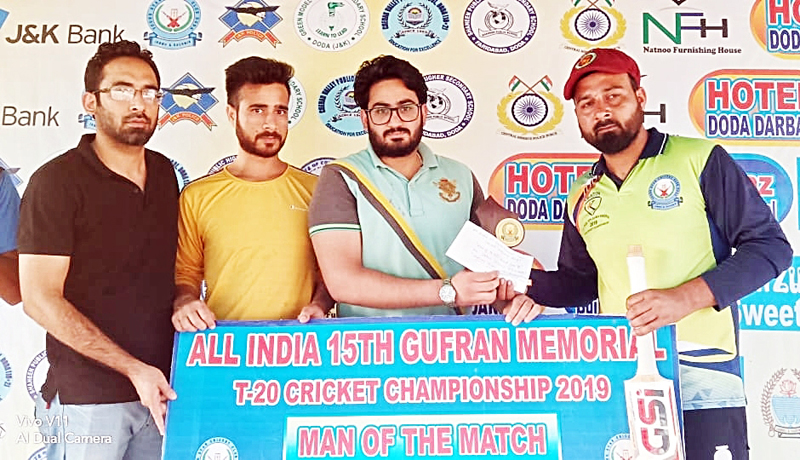 Winner receiving man of the match award during Gufran T20 at Sports Stadium in Doda.