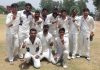 Bhatia Cricket Club players posing for a group photograph after registering win at GGM Science College Hostel ground in Jammu.