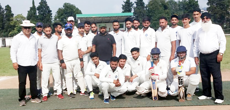 Winners posing for a group photograph during JKCA District Poonch Cricket Tournament at Sports Stadium in Poonch.