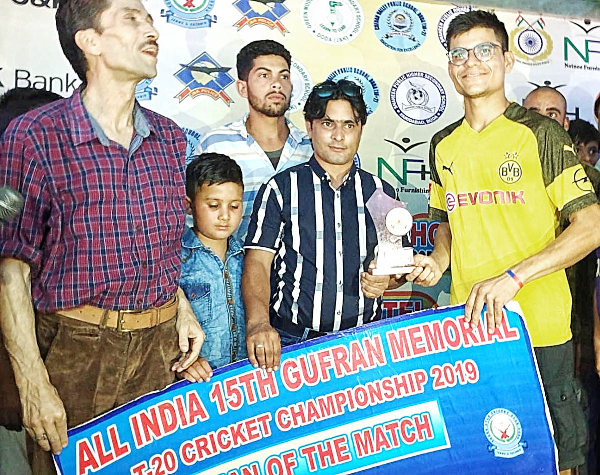 Winner receiving man of the match award during Gufran T20 at Sports Stadium in Doda.