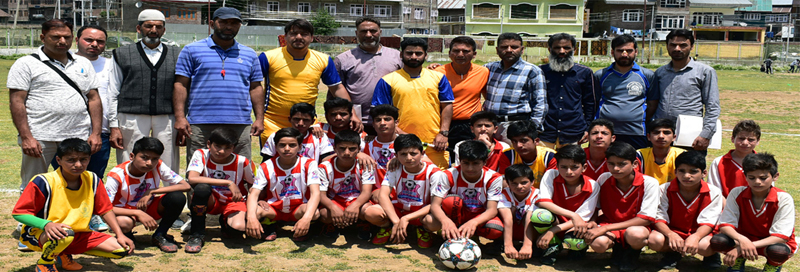 page14 Young footballers posing for a group photograph on inaugural day of inter school football tournament.