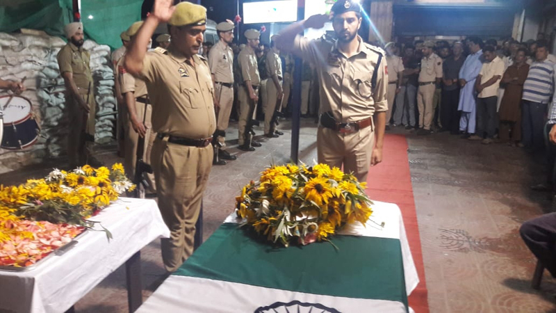 Tributes being paid to martyred cop at DPL Anantnag.
