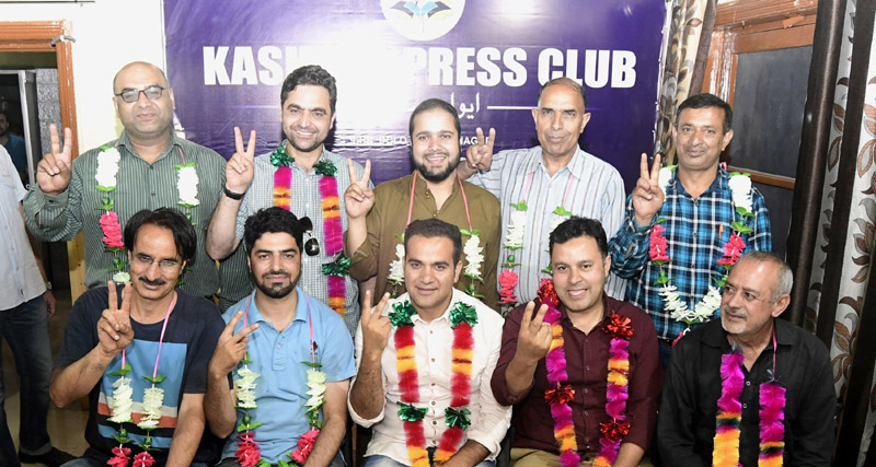 Winners of first-ever elections of Kashmir Press Club posing for photograph in Srinagar. -Excelsior/Shakeel