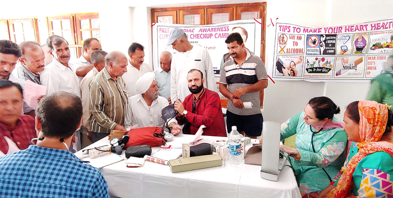 HoD Cardiology GMC & SSH Jammu Dr Sushil Sharma examining patients at R S Pura on Sunday.