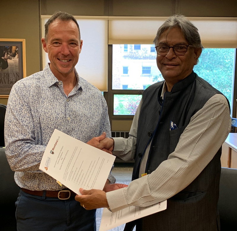 KU VC and Chancellor of Montana Tech. displaying copy of MoU signed between two universities. KU VC and Chancellor of Montana Tech. displaying copy of MoU signed between two universities.